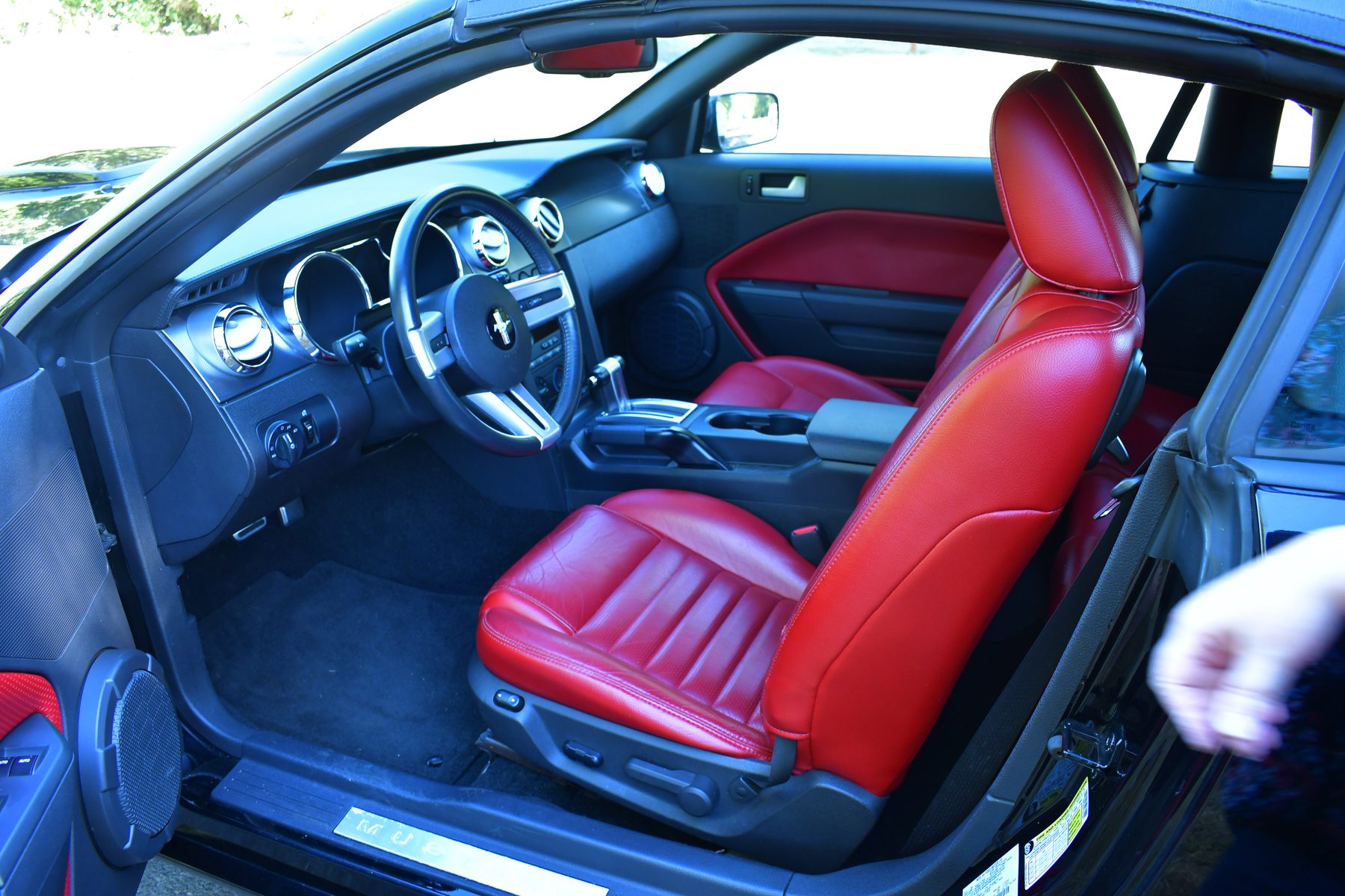 Interior, door open, front seat and dashboard